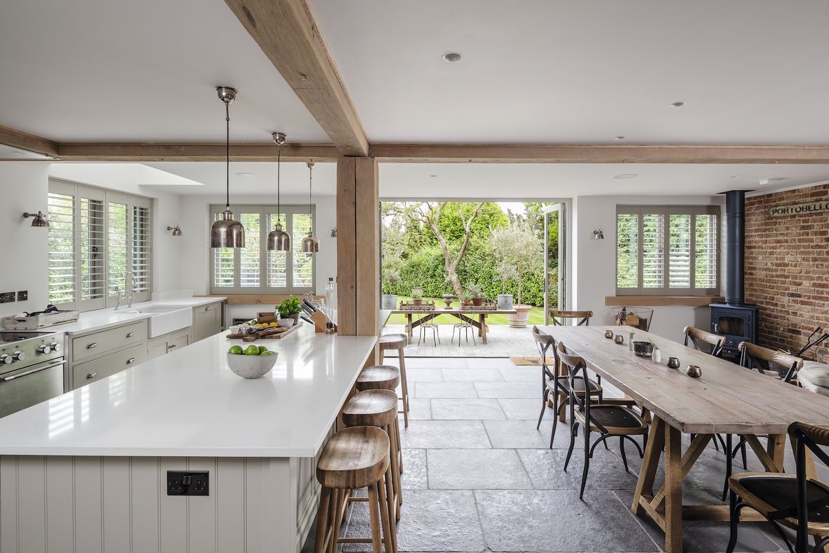 modern kitchen and dining room with wall of glazing