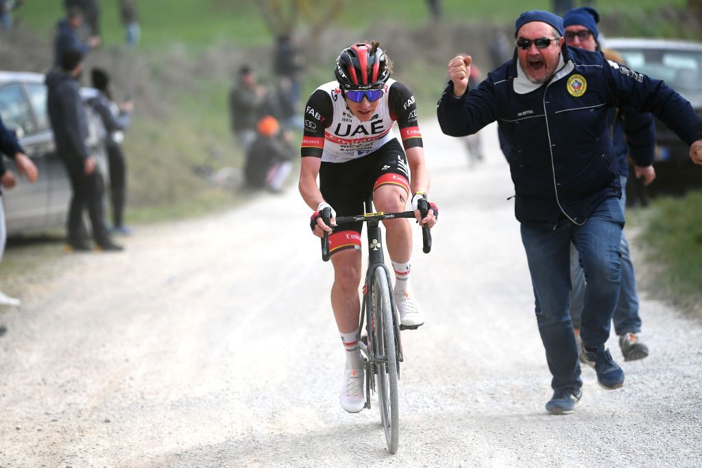 SIENA ITALY MARCH 05 Tadej Pogacar of Slovenia and UAE Team Emirates attacks while fans cheer during the Eroica 16th Strade Bianche 2022 Mens Elite a 184km one day race from Siena to Siena Piazza del Campo 321m StradeBianche WorldTour on March 05 2022 in Siena Italy Photo by Tim de WaeleGetty Images