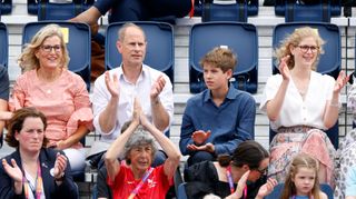 Prince Edward, Duchess Sophie, the Earl of Wessex and Lady Louise cheering in stadium seats