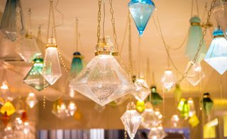 The lanterns hung on the ceiling in colour clusters, and the lights were discreetly turned on and off with a slow breathing pulse. ‘My intention was to create a calming environment to de-stress from the fair,’ says the artist