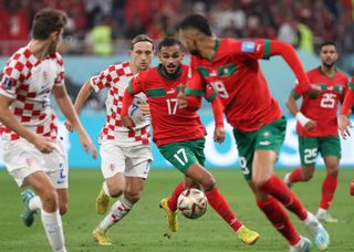 Croatia and Morocco players compete for the ball during their third-place match at World Cup 2022.