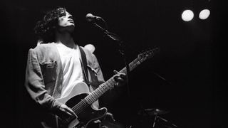 Black and white image of Jeff Buckley playing his Telecaster guitar onstage in the Netherlands in February, 1995