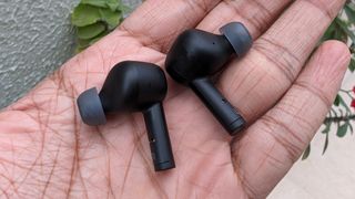 Belkin SoudForm Pulse wireless earbuds held in hand