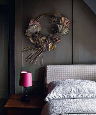 Fall wreath in guest bedroom with grey wall