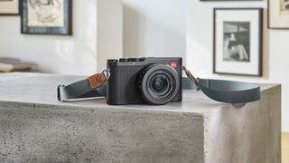 Leica D-Lux 8 compact camera on marble surface in modern house