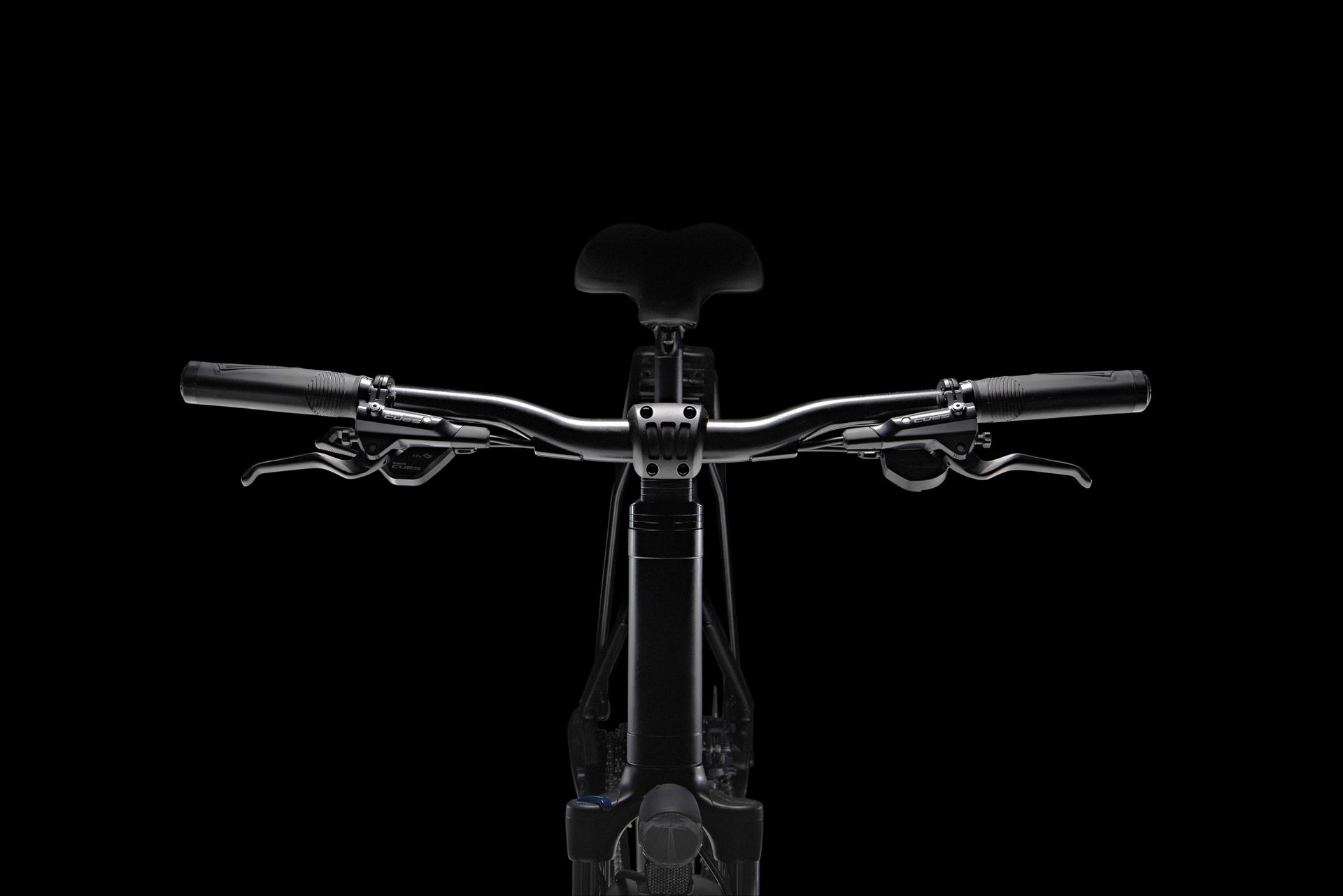 Shimano Cues cockpit showing flat bar shifters