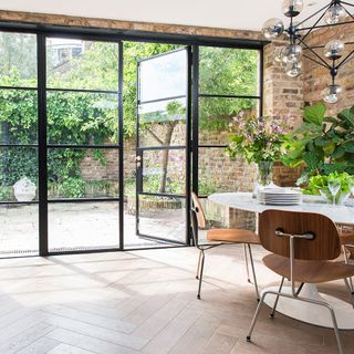 crittall doors and steel windows with wooden chairs