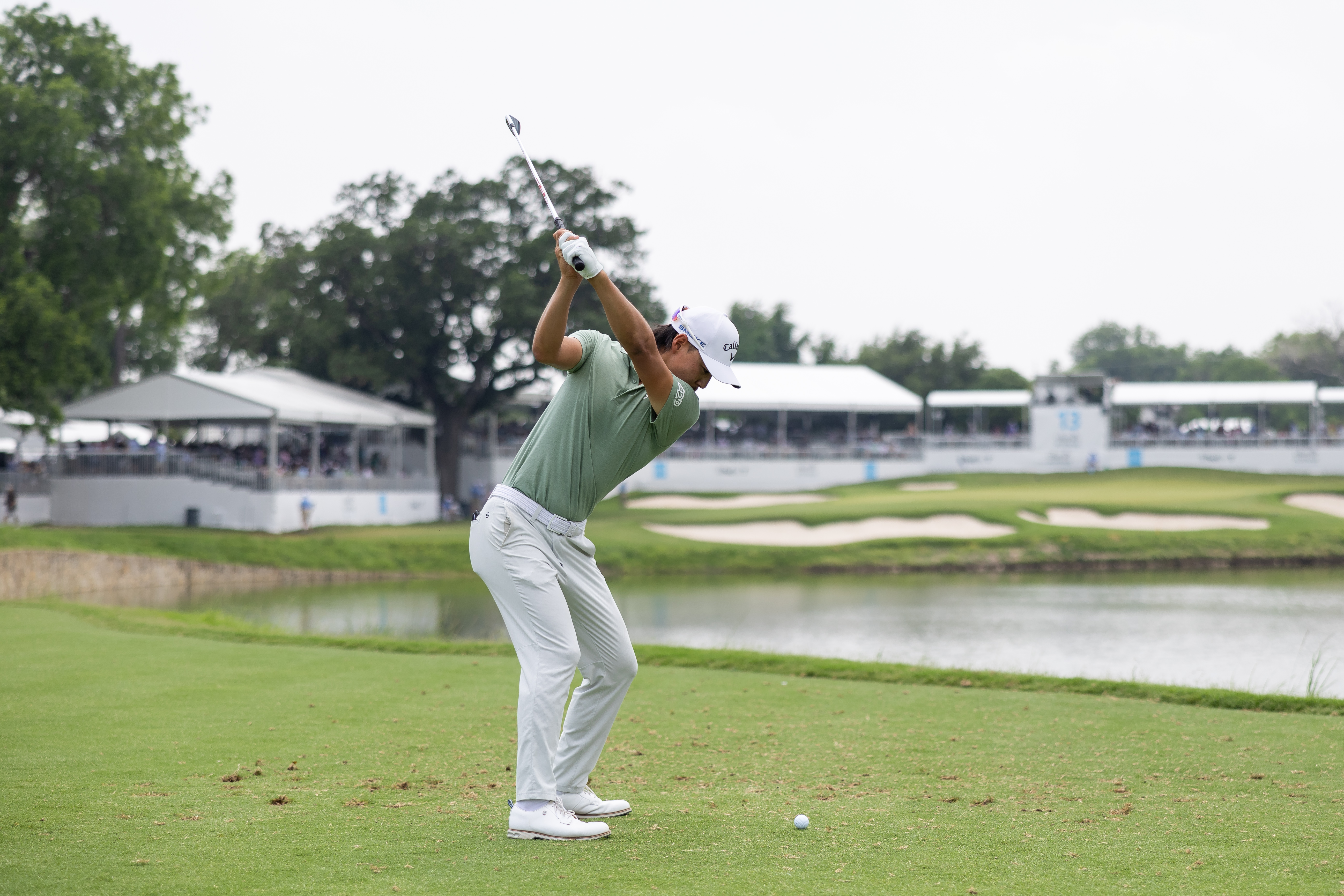 Min Woo Lee at the top of his backswing