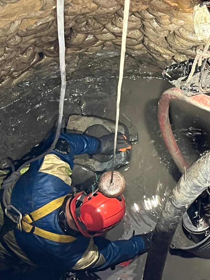 Images from an archaeological excavation showing relics and the well where they were removed from