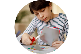 A child cutting shapes out of paper