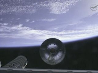 The first stage of Orbital Sciences' Antares rocket drops off during its April 21 launch, as seen from an onboard camera.