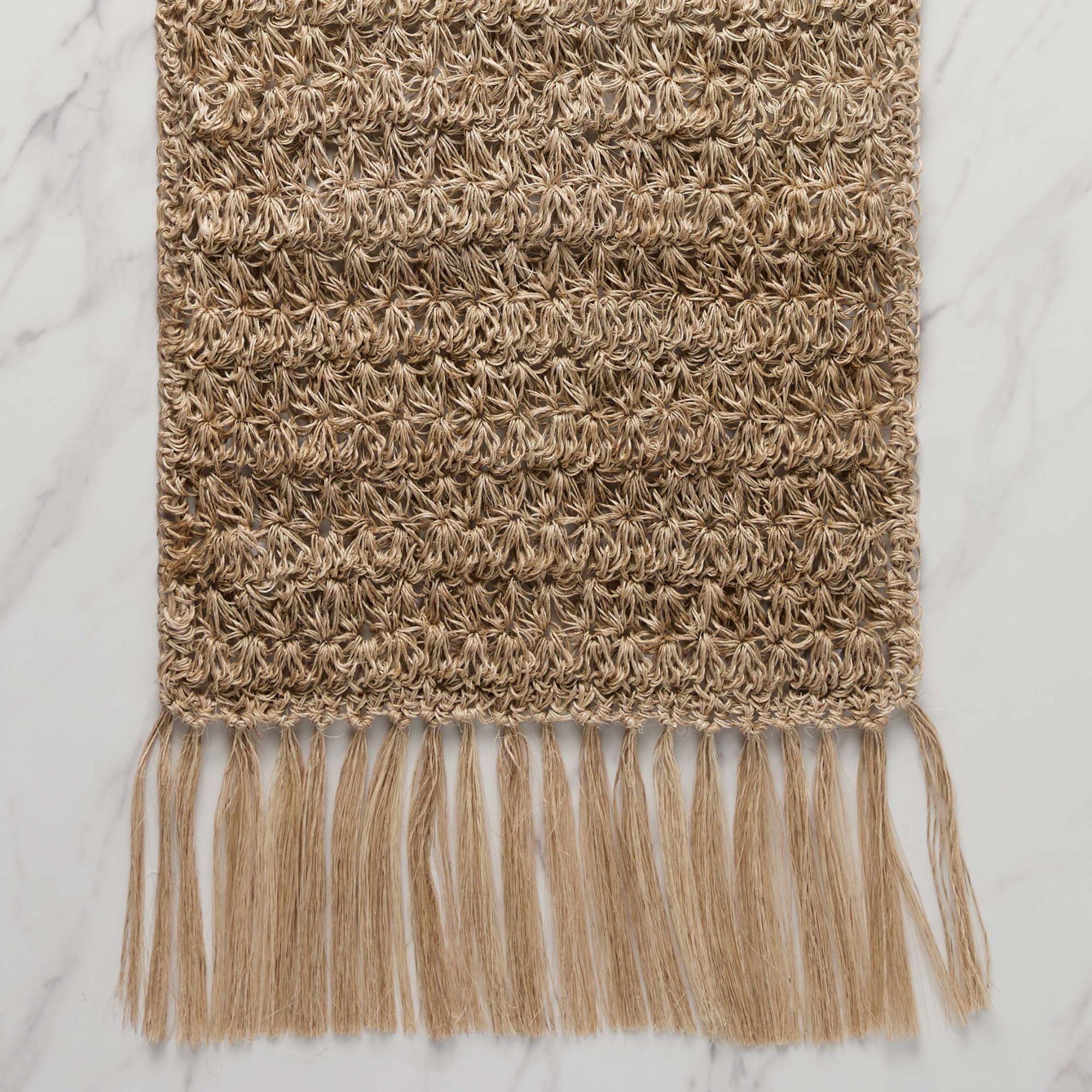 Woven table runner with fringe detail