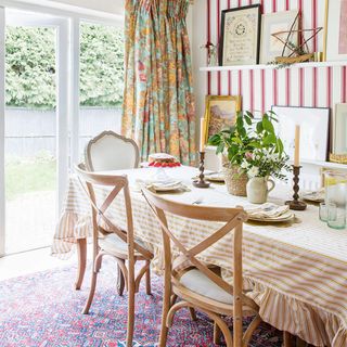 dining room with striped wallpaper