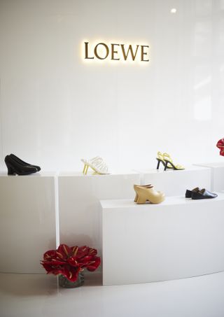 White Loewe pop up with shoes