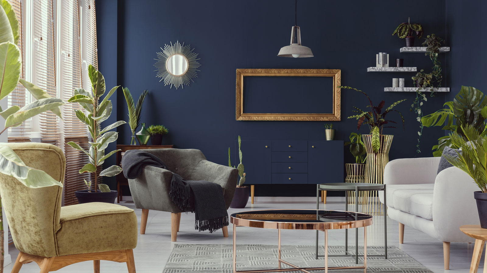 dark blue feature wall in modern living room with wall shelving