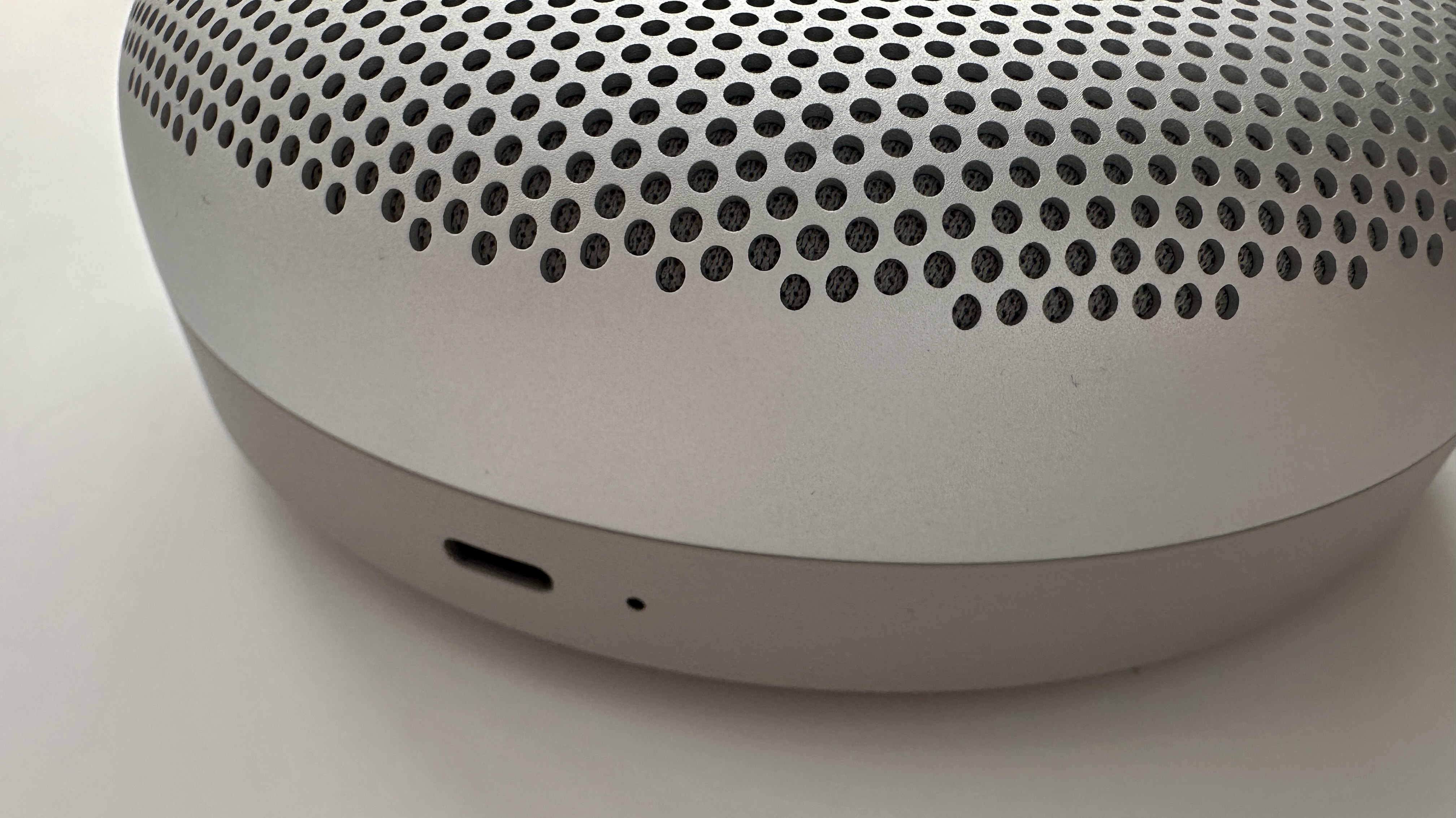 Bang & Olufsen Beosound A1 3rd Generation in silver, on gray table