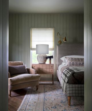 Green bedroom with panelled walls