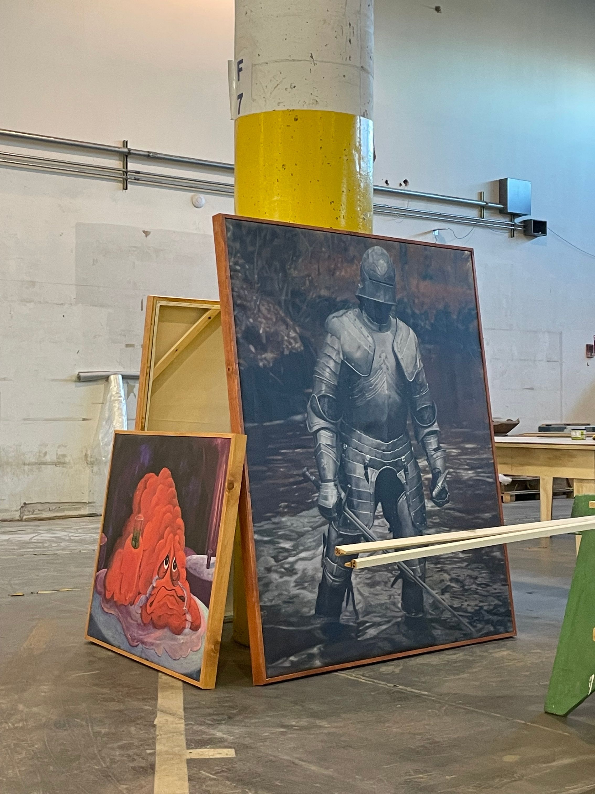 A series of interior shots of an art and objects-filled, dimly lit apartment, a museum's gallery rooms, an empty dance rehearsal room, and colorfully decorated office spaces.