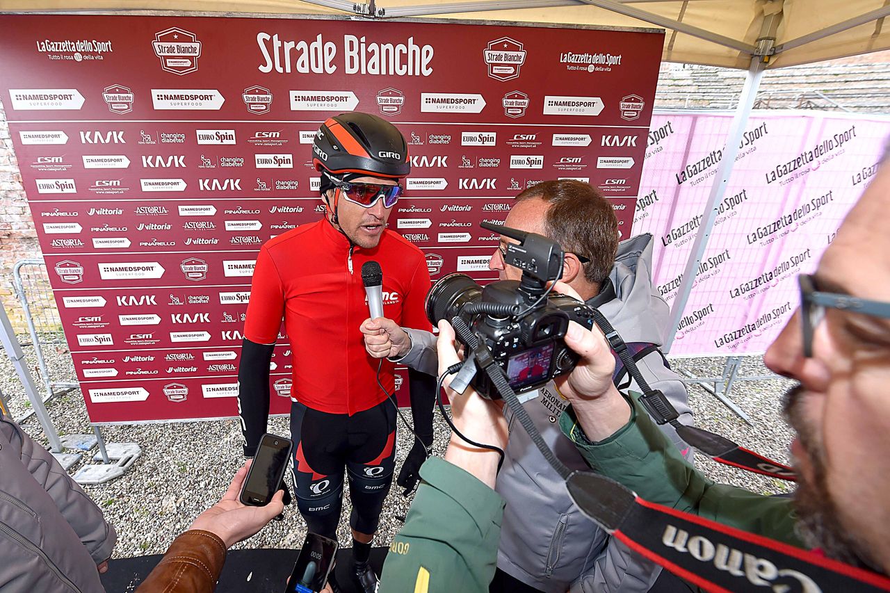 Greg Van Avermaet talks to the press before the start