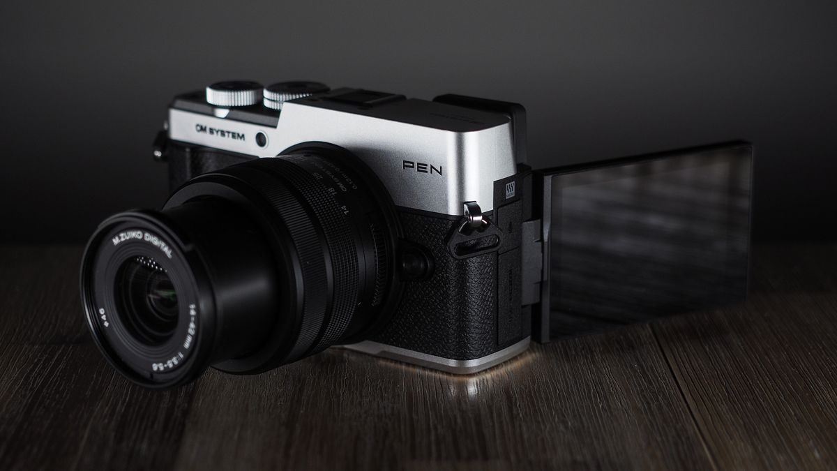 OM System OM-3 with the OM System M.Zuiko 14-42mm 3.5-5.6 III on a wooden surface