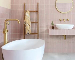 Pastel pink tiled bathroom