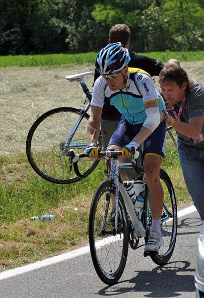 Levi Leipheimer is pushed back into action after getting a bike change.