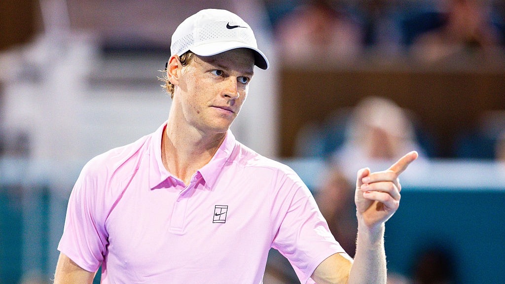 Jannik Sinner points at the crowd after winning a point at the Miami Open.