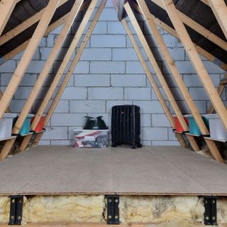 Side profile showing insulation in attic protected by loft leg system