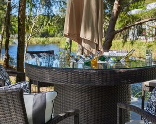 table with ice bucket and parasol