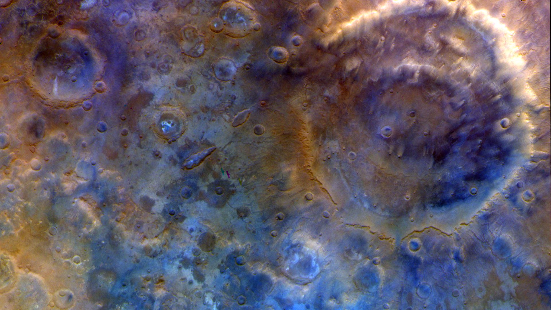 A close up of the surface of Mars, with blue and red colors.