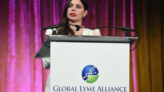 Hilfiger speaking at a Global Lyme Alliance fundraiser