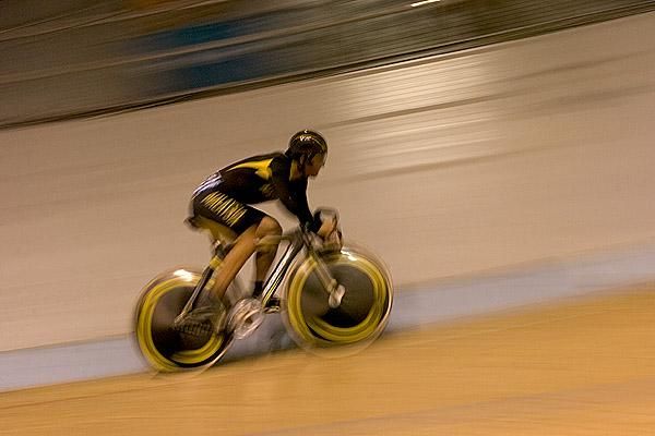 Malaysian mover: A Malaysian rider speeds around the boards during the men's 200m sprint qualifiers.