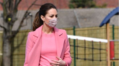 Britain's Catherine, Duchess of Cambridge gestures during a visit to School21 following its re-opening after the easing of coronavirus lockdown restrictions in east London on March 11, 2021. - The visit coincides with the roll-out of Mentally Healthy Schools resources for secondary schools and how this is helping put mental health at the heart of their schools curriculum. (Photo by JUSTIN TALLIS / various sources / AFP) (Photo by JUSTIN TALLIS/AFP via Getty Images)