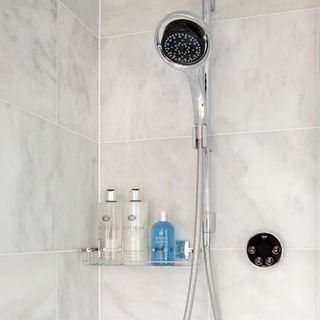 white tiled shower with showerhead