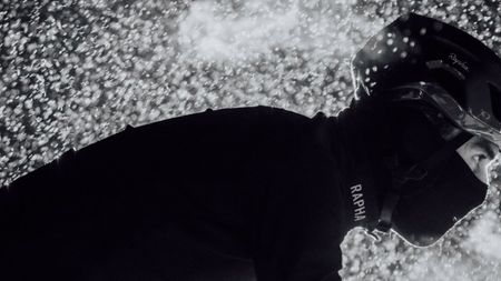 Male rider in Rapha kit cycling in snow