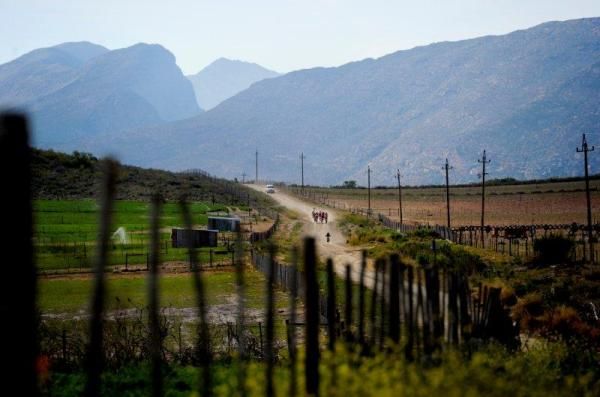 The riders approach the Swartberg mountains.
