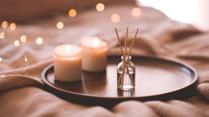 candles and a diffuser in a cozy atmosphere indoors - stock photo