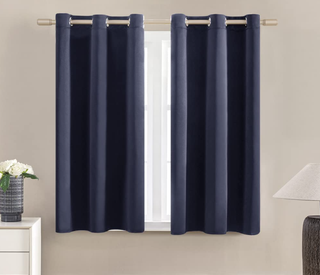 A pair of long dark blue curtains