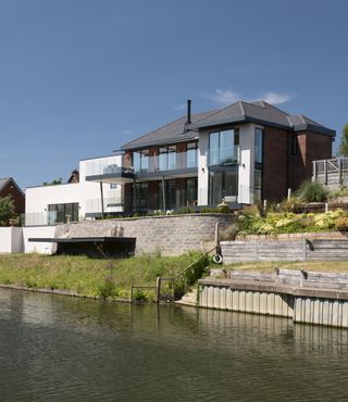 Building a riverside home on a sloping site