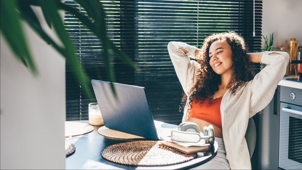 A woman sitting at her desk