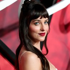 Dakota Johnson styled a navy blue and fur-trimmed Valentino jacket at a 'Verity' after-party, which Jennifer Lawrence and Kendall Jenner own, too