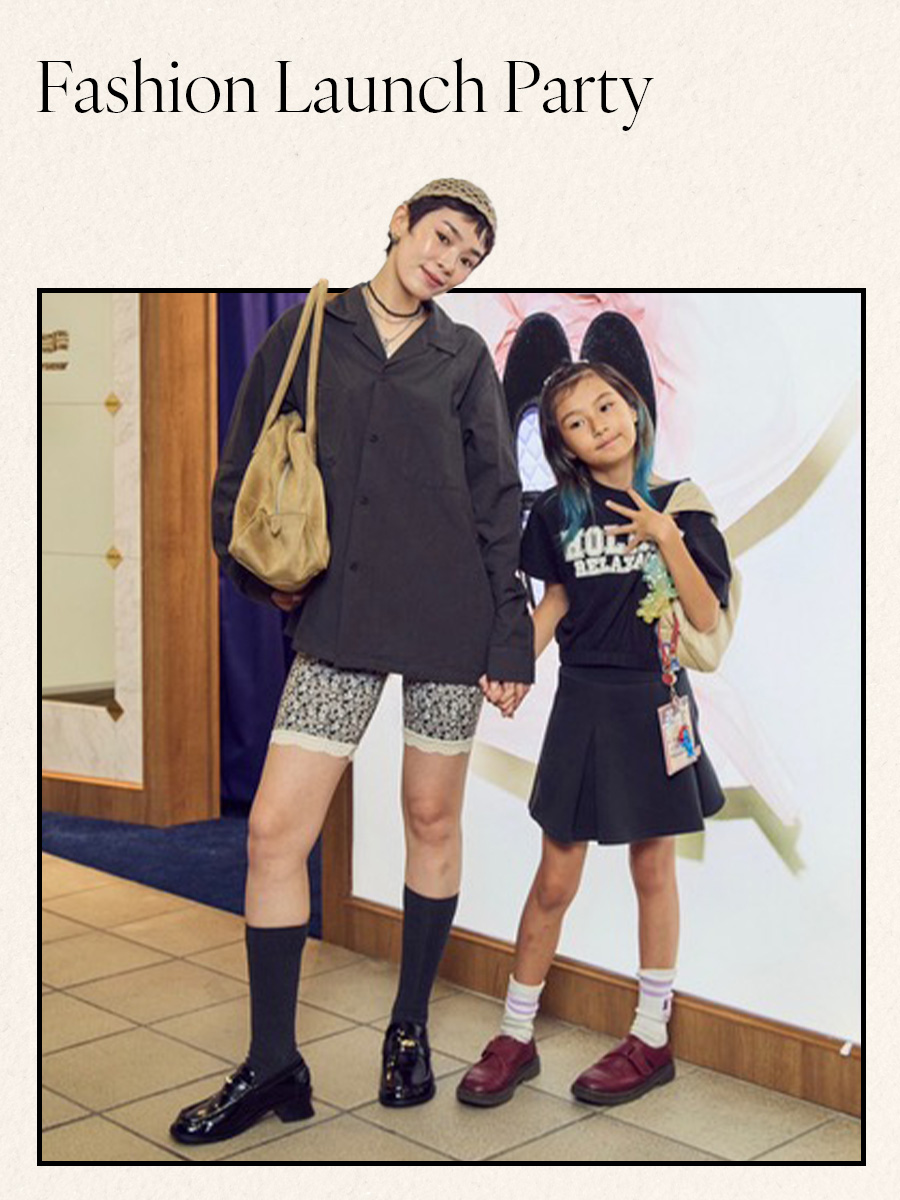 Woman in black shirt and floral shorts