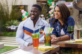 Kevin Hart as Sonny and Regina Hall as Maya, at a bar, in Me Time