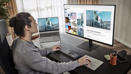 A man using the Samsung ViewFinity S8 (S80UD) for design work