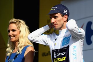 Simon Yates in white at after stage 6 at the Tour de France