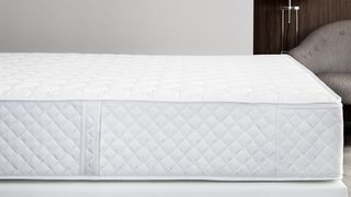 An EU Marriott bed hybrid mattress on a bed frame