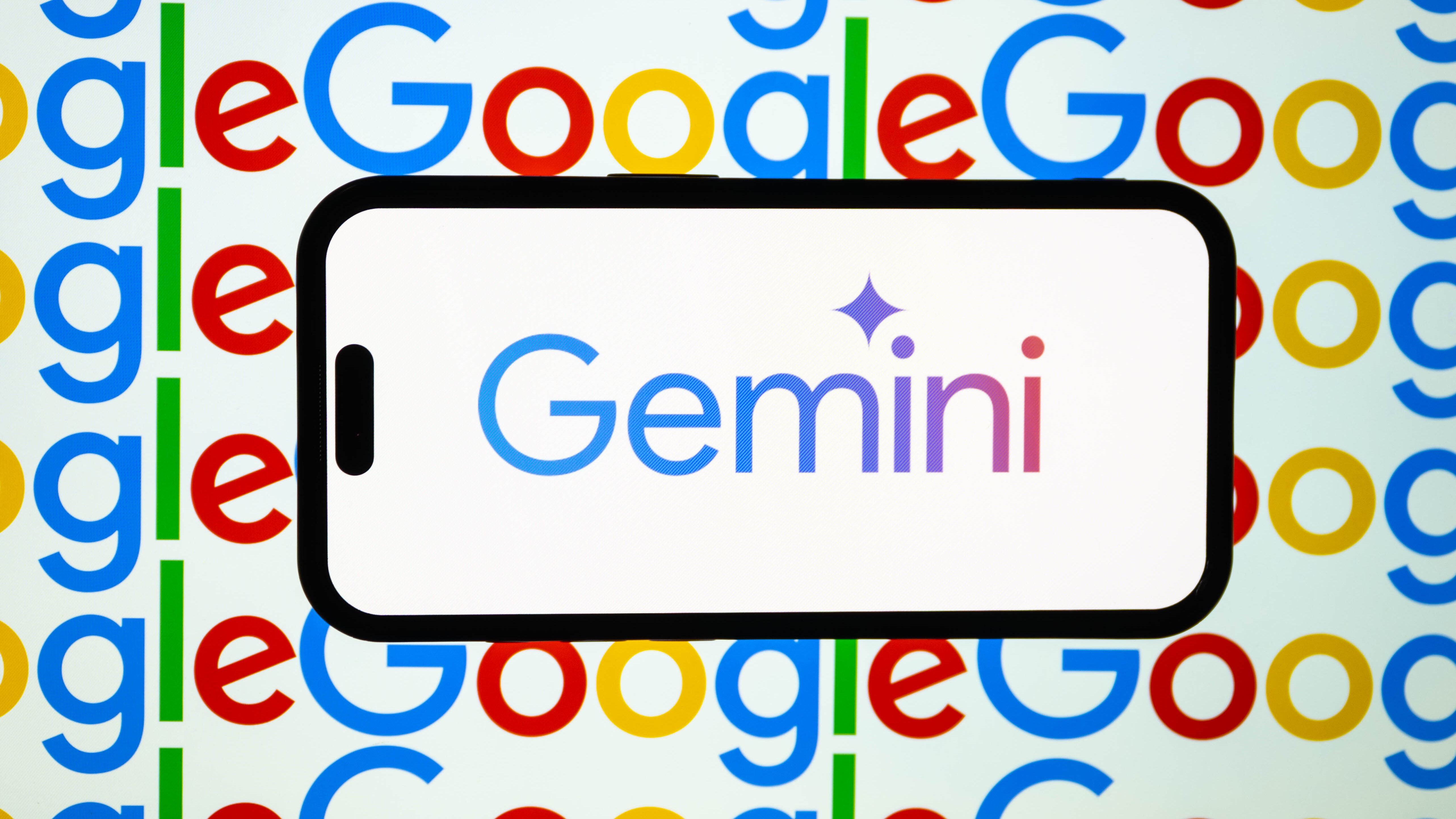 Gemini on a phone with a Google background.