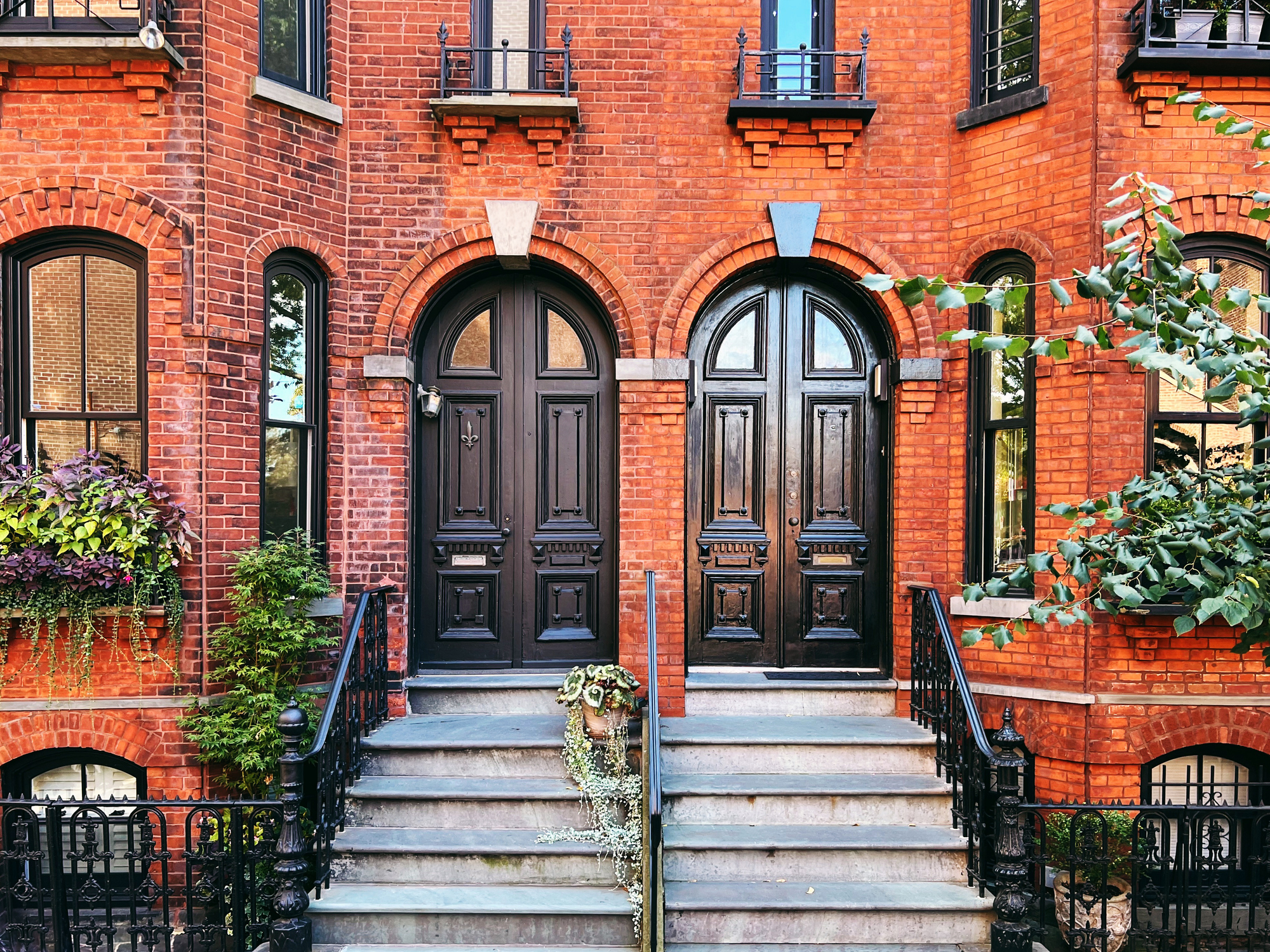 Door entrance of the red brick row house in Brooklyn Heights, New York City, USA - stock photo