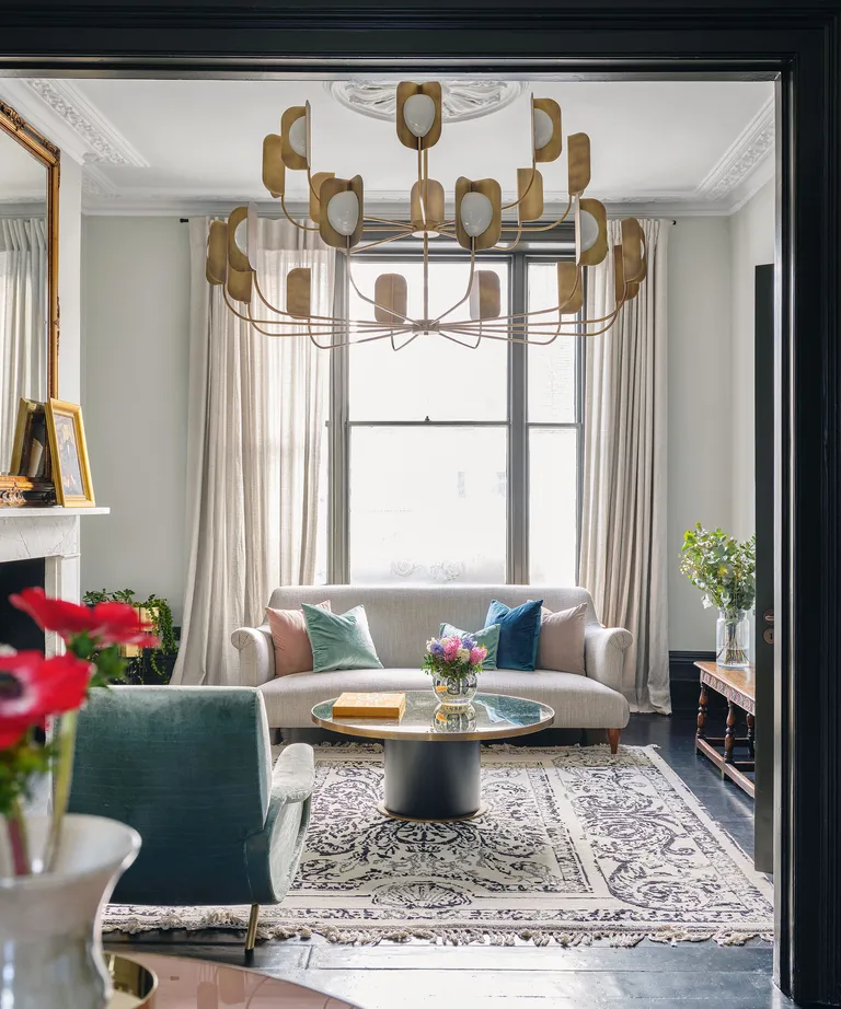 neutral living room with modern sofa and large window