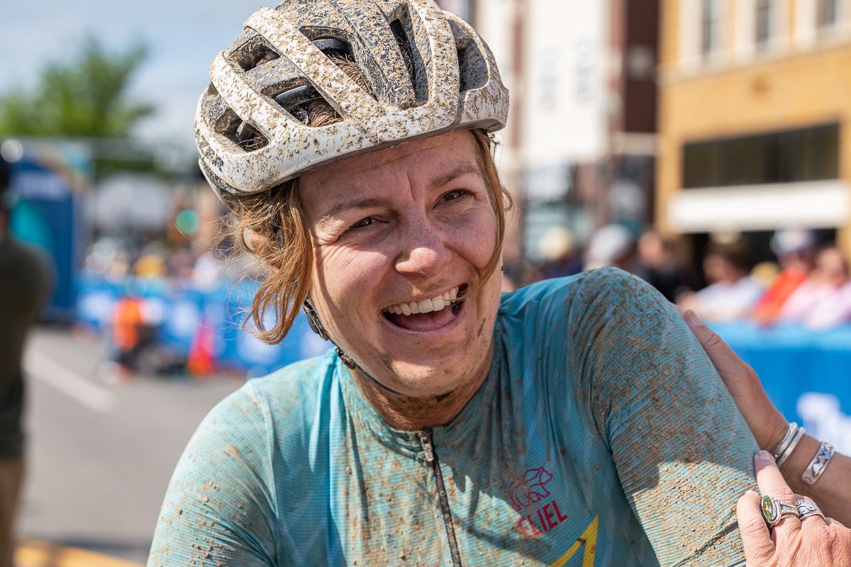 A joyous Whitney Allison chats with friends at the finish line about her forth place finish.